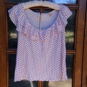 Tank with flutter neck